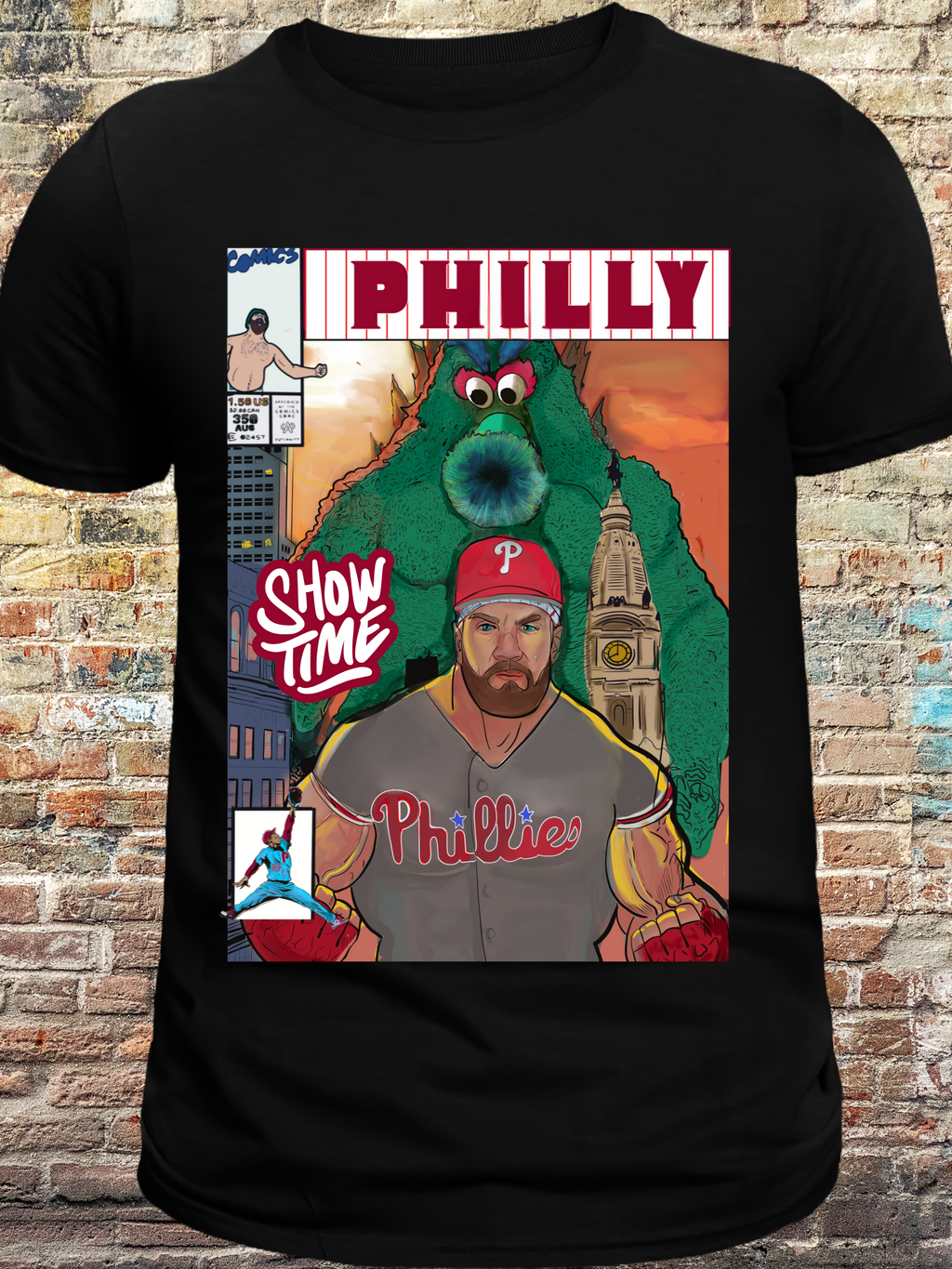 Black t-shirt featuring a comic book cover design with a muscular baseball player, a large green mascot, and Philadelphia skyline in the background — bold artwork with 'PHILLY' and 'Show Time' text, perfect for passionate Philly baseball fans
