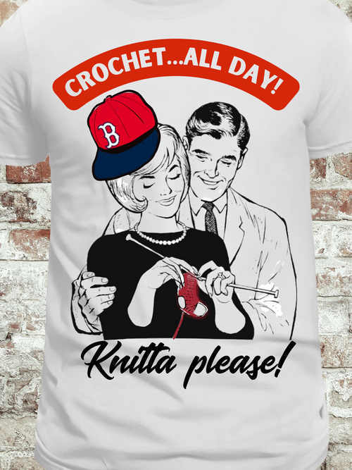 White t-shirt featuring a vintage-style couple, with the woman crocheting red yarn and the phrase 'Crochet...All Day! Knitta please!' in bold text