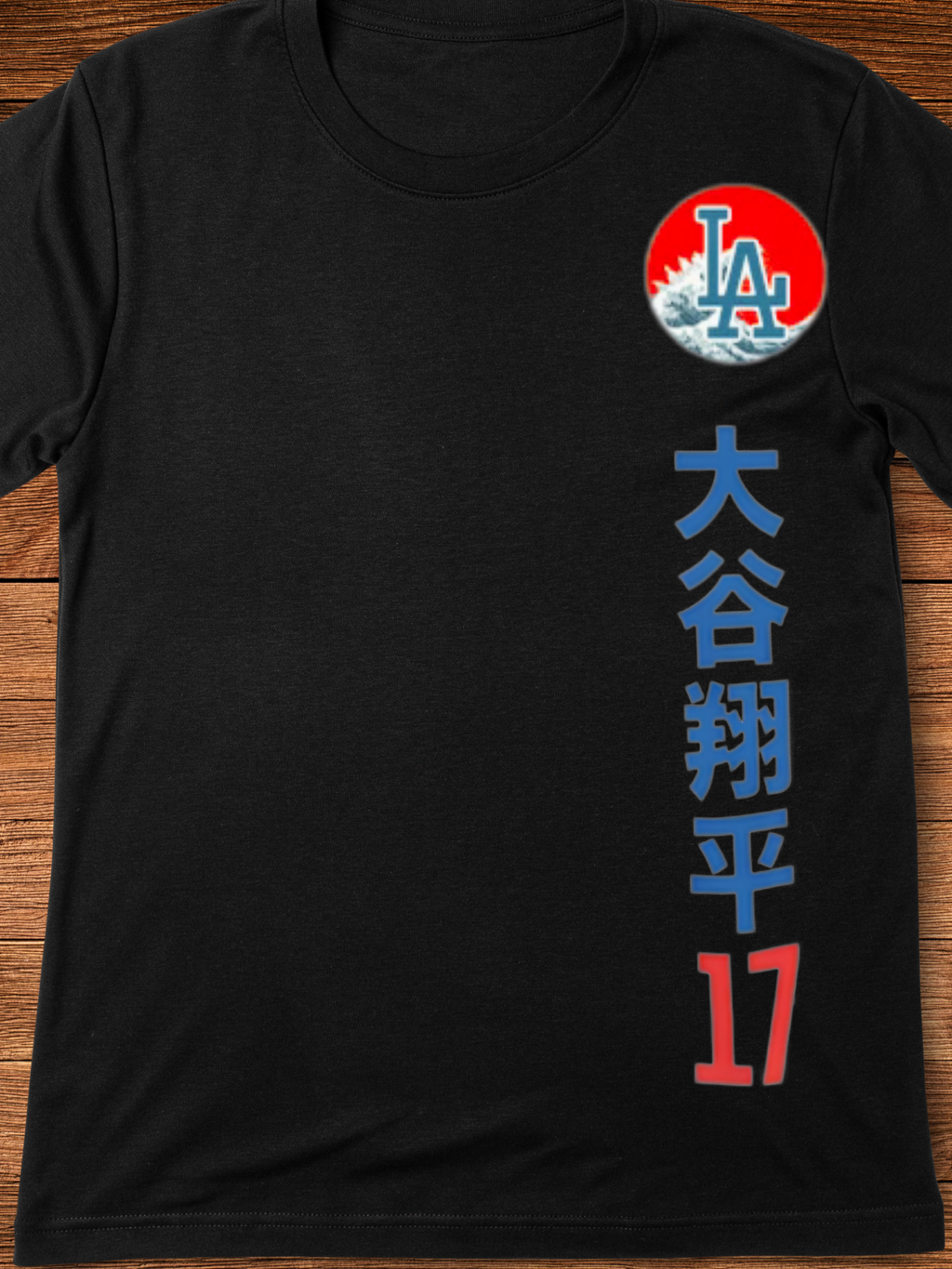Graphic t-shirt with a split-face design featuring a blue samurai mask and a baseball player in a white and blue uniform, set against a red circle with Japanese characters above — representing dual power and cultural fusion