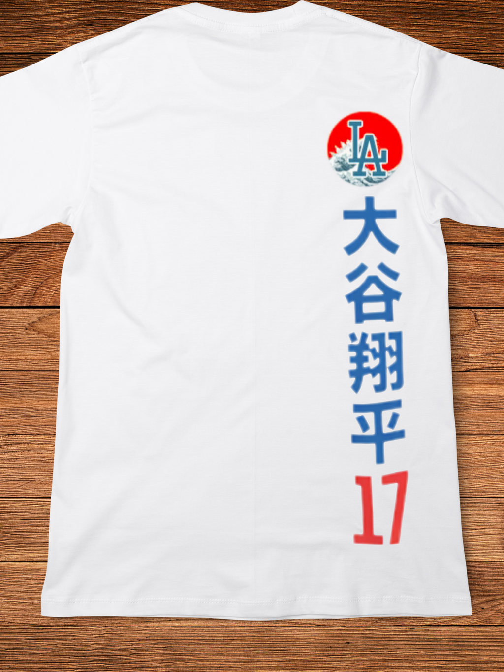 Graphic t-shirt with a split-face design featuring a blue samurai mask and a baseball player in a white and blue uniform, set against a red circle with Japanese characters above — representing dual power and cultural fusion
